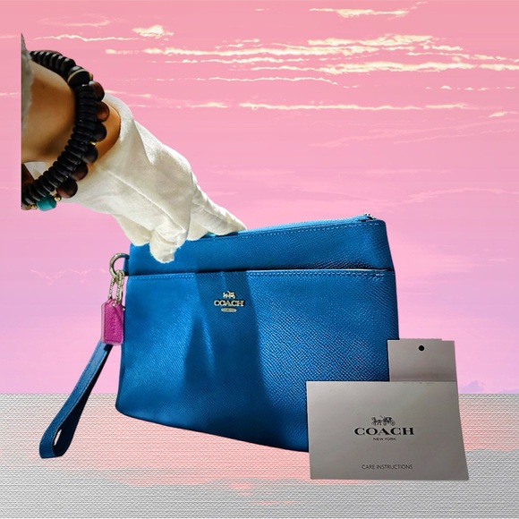 Coach Handbags - Coach Vibrant Blue Wristlet with Pink Accent new without tags